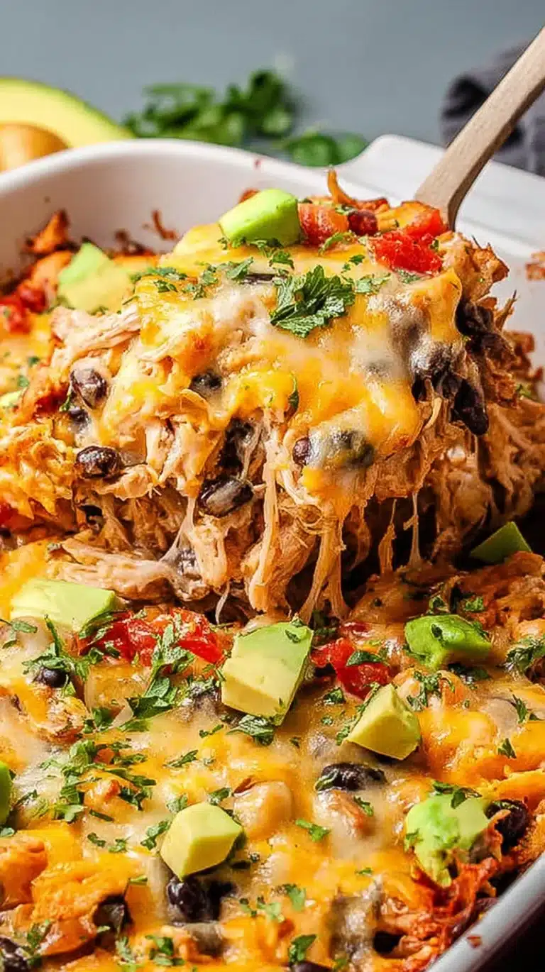Easy chicken burrito casserole topped with cheese and served in a dish