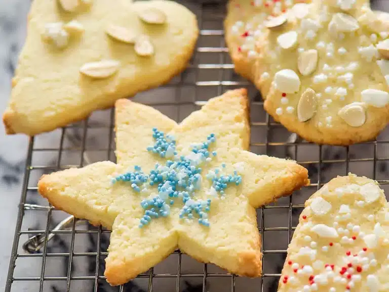 Baking tray filled with freshly baked almond flour sugar cookies