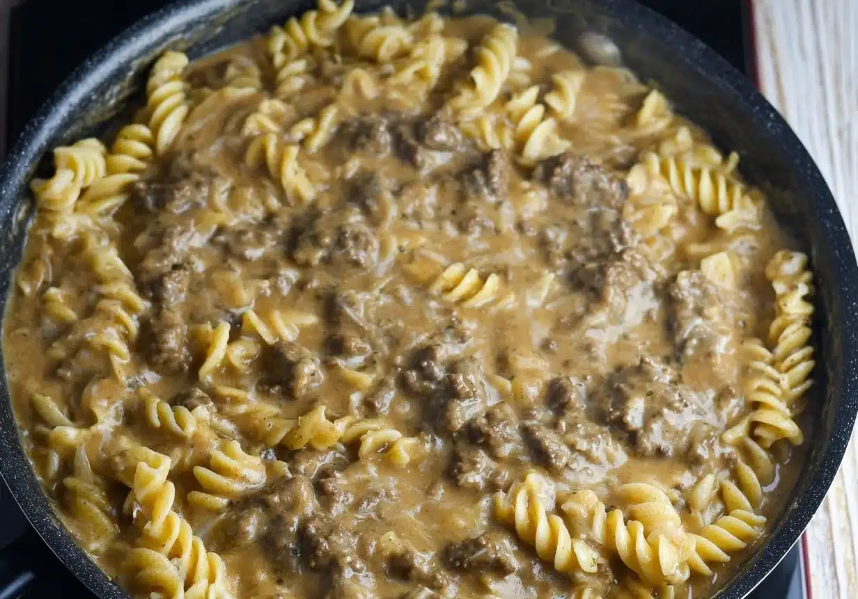 Gluten-free and dairy-free beef stroganoff served in a bowl with parsley garnish