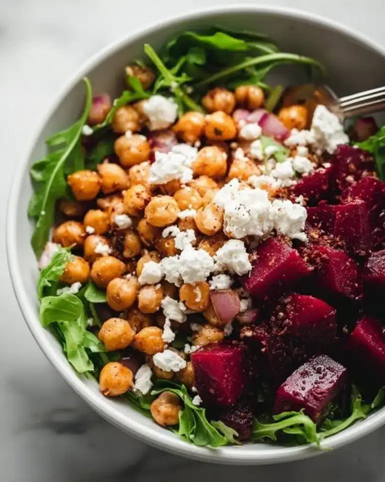 Chickpea salad with beets and feta cheese in a bowl, healthy recipe.