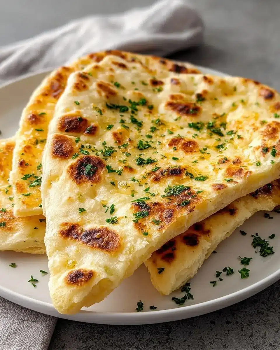 Homemade easy garlic flatbread with herbs and garlic, perfect for sharing.