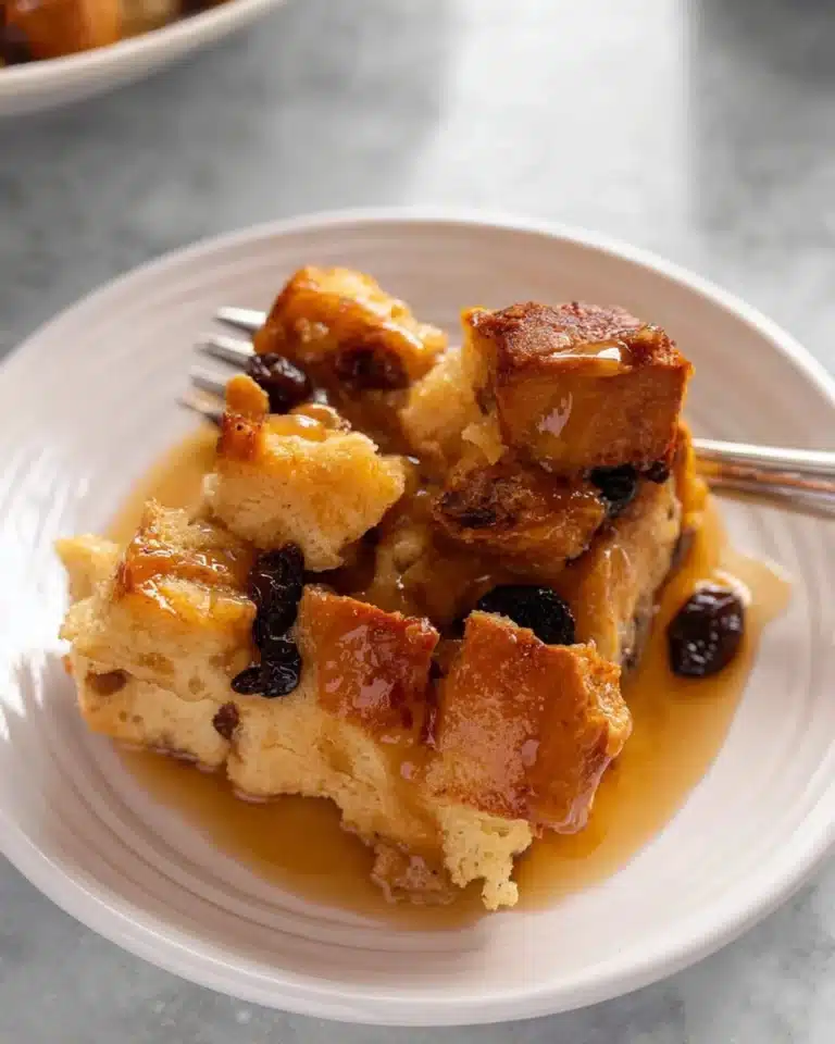 Delicious Irish Bread Pudding drizzled with creamy sauce