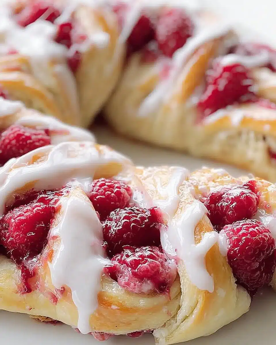 Delicious Lemon Raspberry Danish rolls with cream cheese filling on a plate