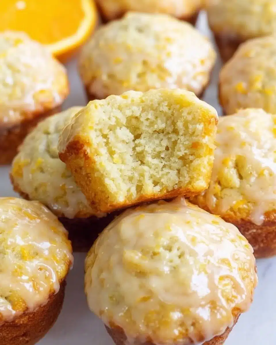 Delicious Orange Vanilla Buttermilk Muffins on a plate, garnished with orange zest.