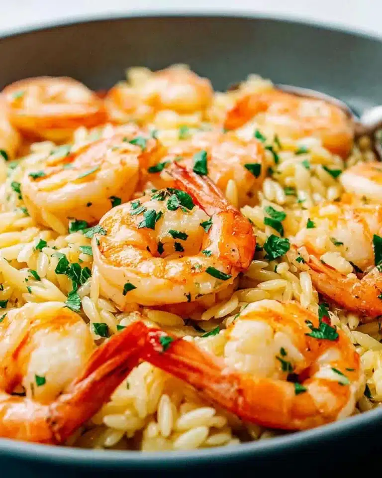 Plate of savory shrimp scampi orzo with garlic and herbs