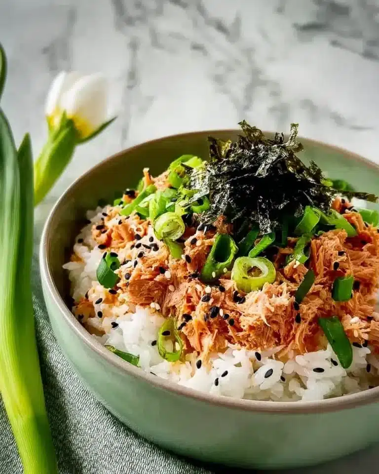 Sesame spicy tuna rice bowl with fresh ingredients and vibrant colors