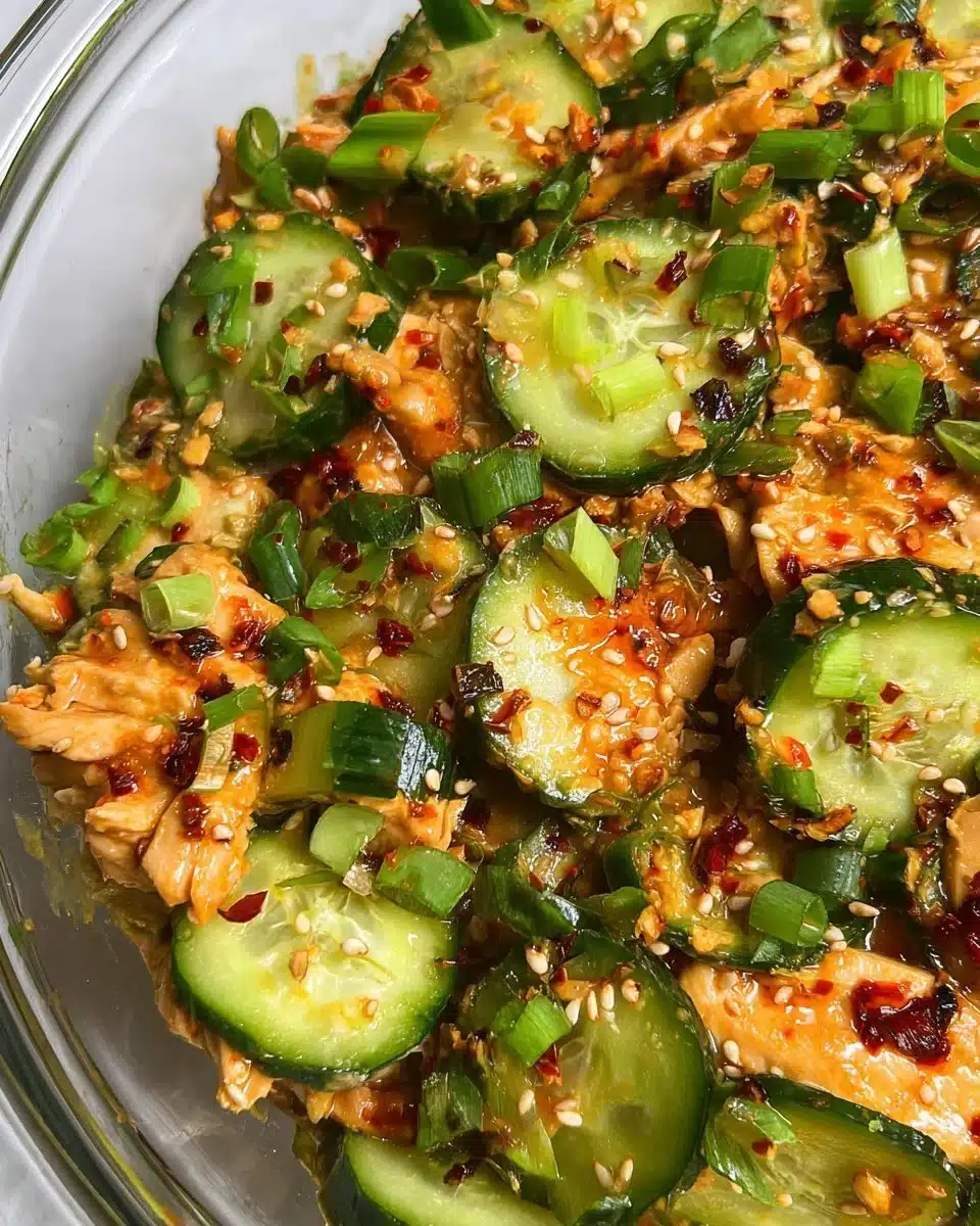 Thai cucumber salad with chicken featuring fresh cucumbers and vibrant herbs.