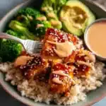 Bang Bang Salmon Rice Bowl with fresh salmon, rice, and vibrant vegetables.