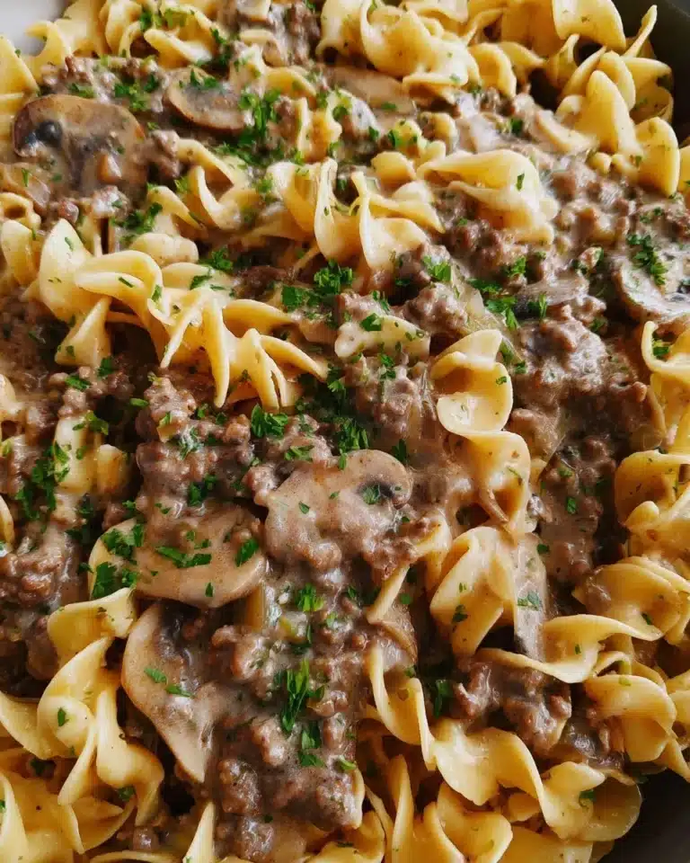 Delicious Beef Stroganoff Casserole topped with herbs and spices