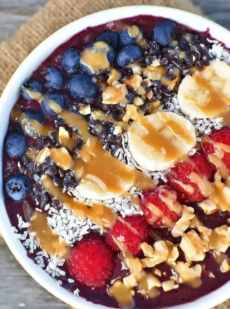 Delicious Blueberry Green Tea Acai Bowl topped with fresh fruits and granola