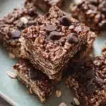 Homemade chocolate oat bars with chocolate drizzle and oats