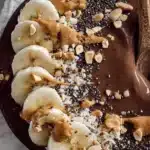 Chocolate Peanut Butter Smoothie Bowl topped with fresh fruit and granola