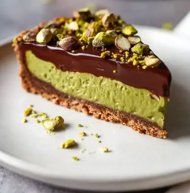 Delicious Chocolate Pistachio Tart with a rich chocolate filling and nutty topping.