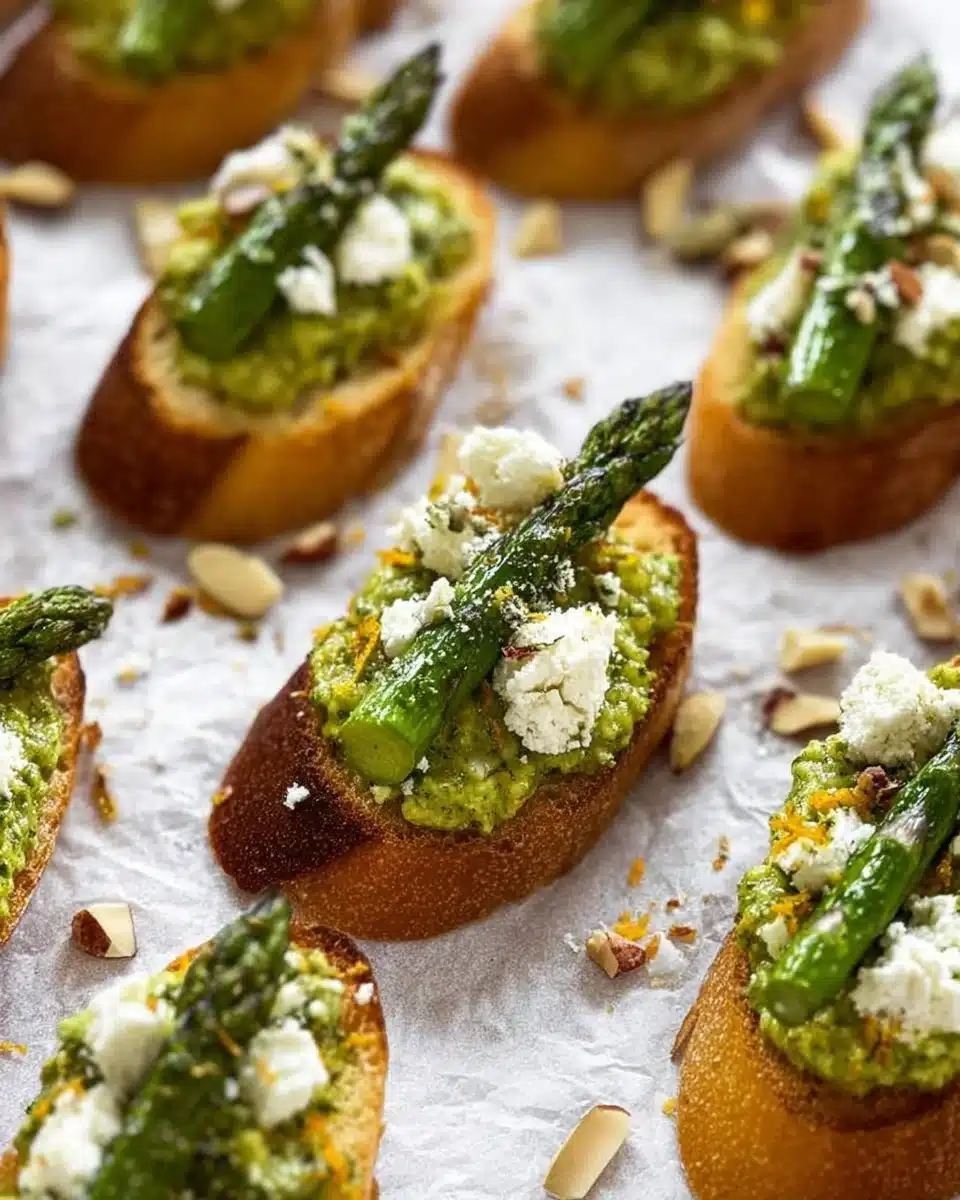 Citrus Pesto Crostini topped with creamy goat cheese and fresh herbs.