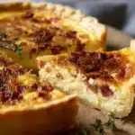 Delicious Classic Quiche Lorraine with bacon and cheese on a flaky crust