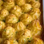 Golden Duchess Potatoes served elegantly on a plate