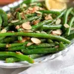 Green Beans Almondine with toasted almonds and a garnish of lemon zest