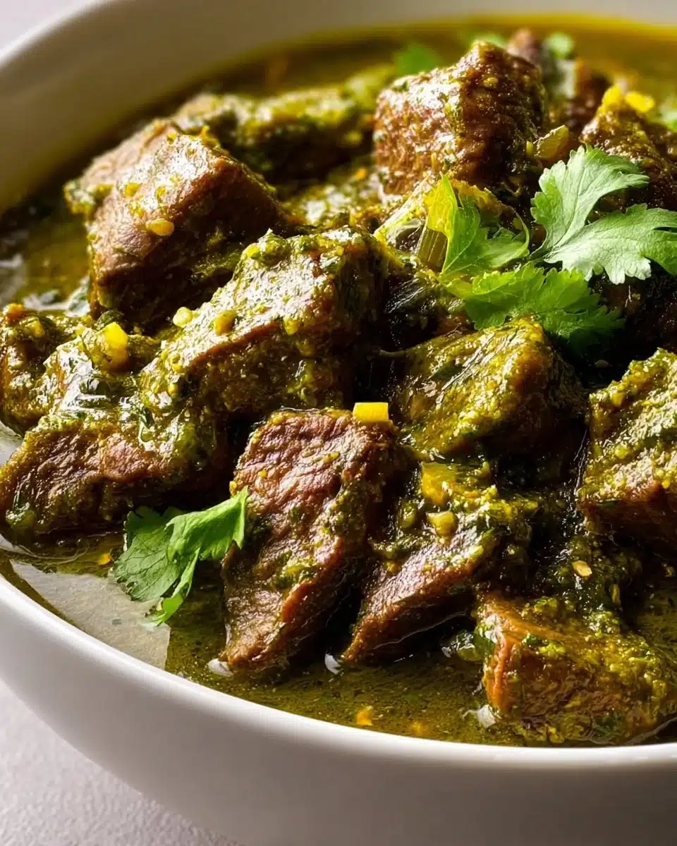 Bowl of Mexican Beef Green Chili topped with fresh cilantro and cheese