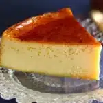 Delicious homemade Mexican Flan garnished with caramel sauce and fresh berries