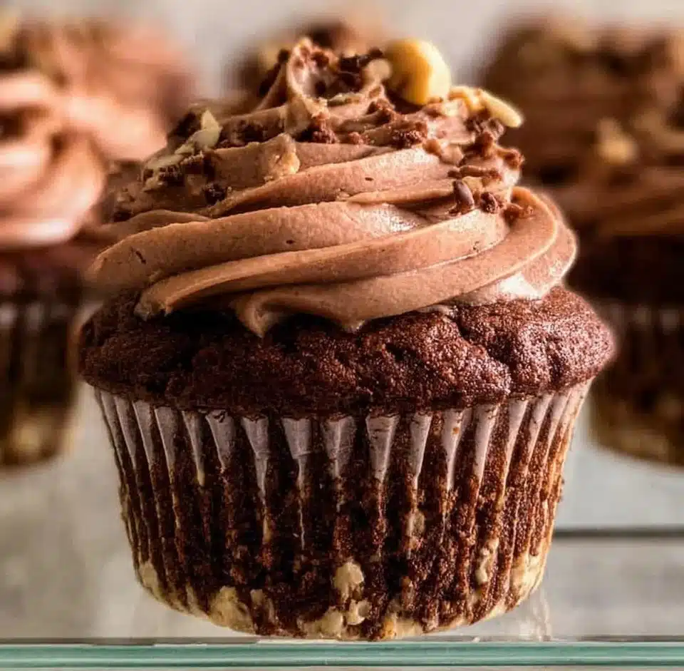 Delicious Nutella Cupcakes topped with creamy frosting and chocolate sprinkles