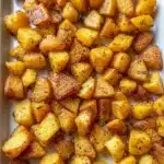 Bowl of crispy oven-roasted breakfast potatoes seasoned and ready to serve.