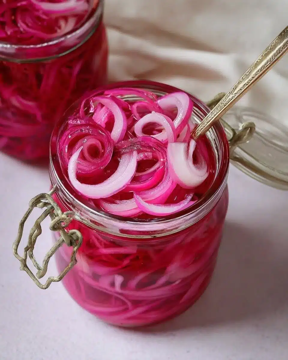Jar of pickled red onions ready for food preparation