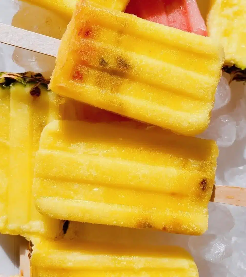 Refreshing pineapple popsicles served on a sunny day.