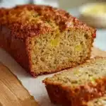 Slice of moist Pineapple Zucchini Bread with tropical flavors