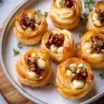 Delicious puff pastry brie bites with a golden crust and melted cheese