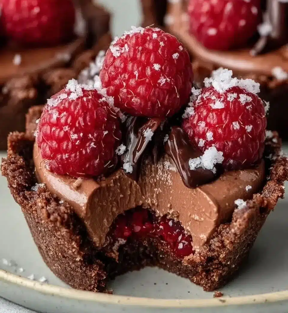 Delicious Raspberry Chocolate Mousse Cups garnished with fresh raspberries
