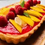 Delicious Raspberry Mango Tart with fresh raspberries and mango slices
