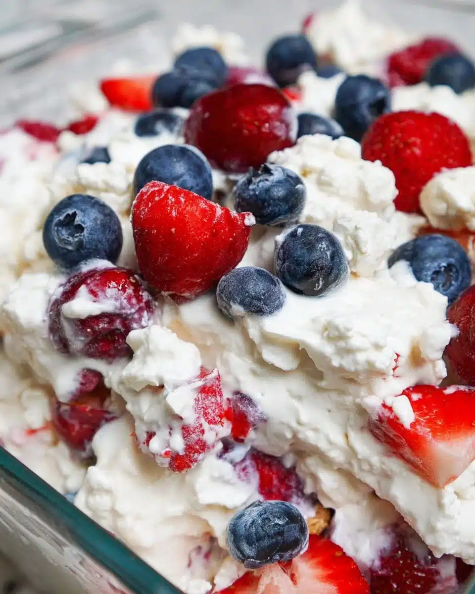 Red, White, and Blue Cheesecake Salad featuring fresh berries and creamy cheesecake