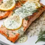Delicious salmon with lemon dill sauce on a plate