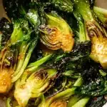 Sautéed baby bok choy served in a bowl with sesame seeds