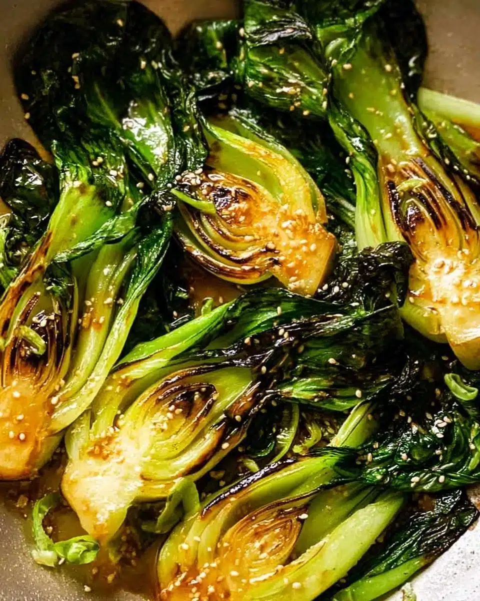Sautéed baby bok choy served in a bowl with sesame seeds