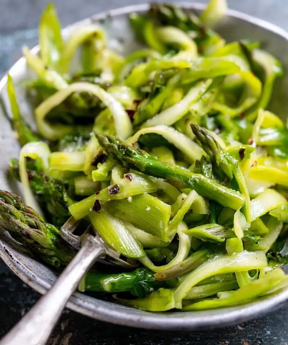 Delicious shaved asparagus salad topped with lemon and parmesan