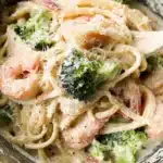 Shrimp broccoli pasta served with garlic sauce and parmesan cheese