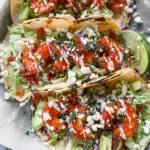Delicious shrimp tacos served with fresh toppings and lime