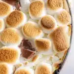 Delicious S'mores Dip served with graham crackers for dipping.
