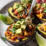 Tex-Mex stuffed avocados filled with savory ingredients on a plate