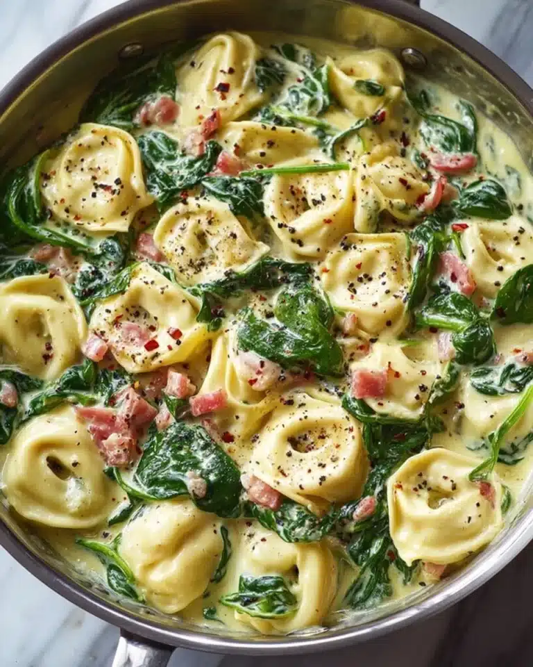 Tortellini with spinach served in a bowl, showcasing fresh ingredients and flavors.