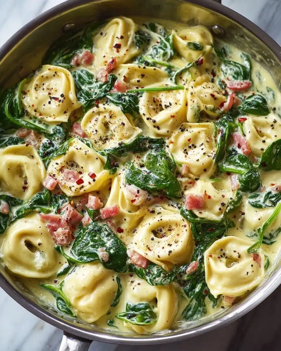 Tortellini with spinach served in a bowl, showcasing fresh ingredients and flavors.
