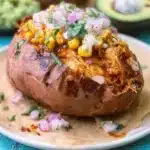 BBQ chicken stuffed in baked sweet potatoes with toppings