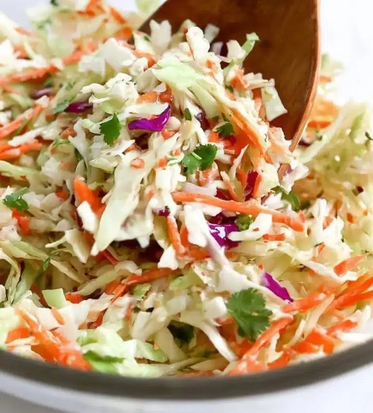 Fresh and colorful cabbage salad with vegetables in a bowl