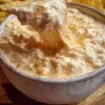Delicious cottage cheese queso dip served in a bowl with tortilla chips