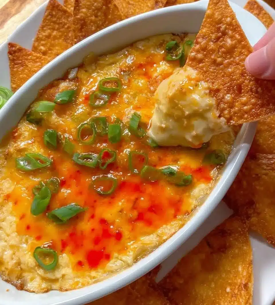 Delicious Crab Rangoon Dip served in a bowl with crackers