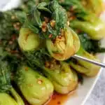 Stir-fried Garlic Bok Choy with vibrant green leaves and garlic cloves