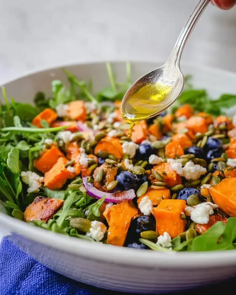 A vibrant Honey Sweet Potato Salad with colorful ingredients and a sweet dressing.