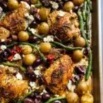Delicious Mediterranean Chicken served with fresh vegetables and herbs.