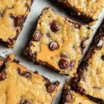Peanut Butter Chocolate Chip Bars ready to eat, featuring chocolate chips and creamy peanut butter.